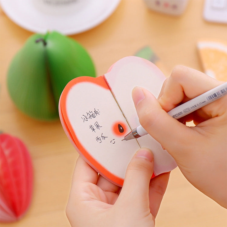 Peach-shaped sticky note sticker being written on, with orange edge and small face