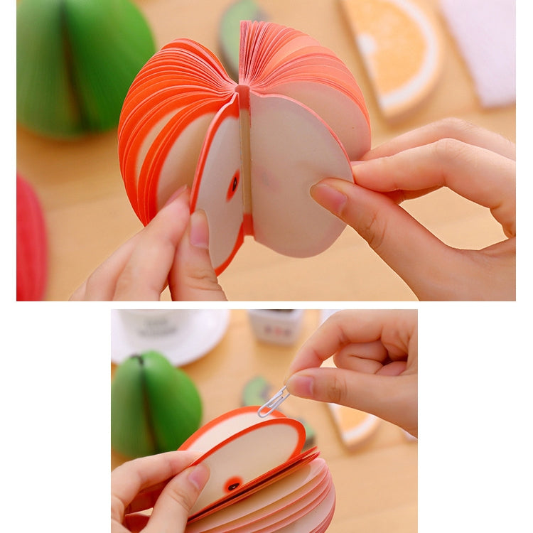 Peach-shaped note sticker fold opened; hands peel and stack multiple pieces