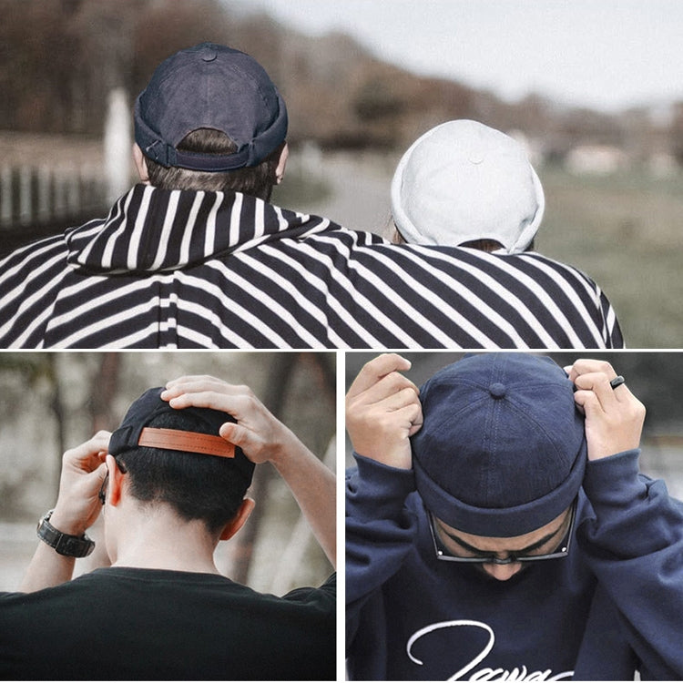 Navy sailor beanie worn on back view with rolled cuff and brown side strap
