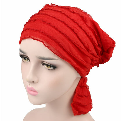 Red chiffon fold turban cap with stacked pleats and side drape for head coverage