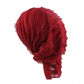 Red chiffon fold turban cap viewed from the back with stacked pleated texture