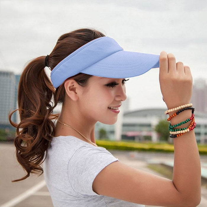 Light blue visor cap with curved brim and textured lightweight fabric panel.
