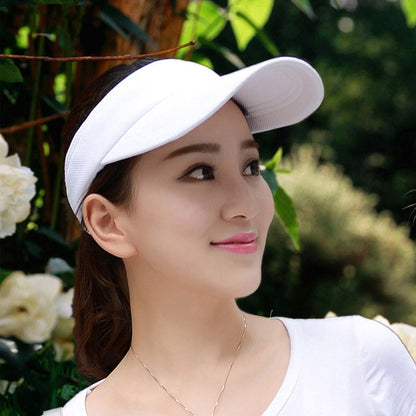 White visor cap with curved brim and lightweight mesh-like fabric panel.