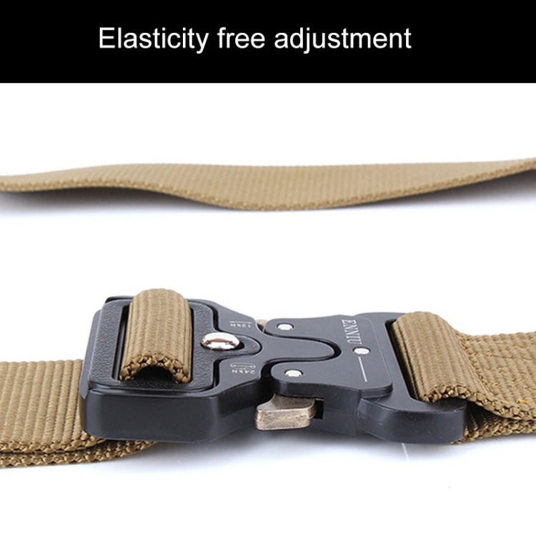Tactical nylon belt with tan webbing and black buckle, showing adjustable strap edge