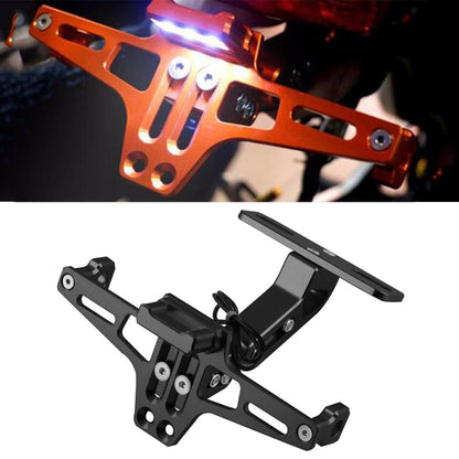 Orange aircraft-style aluminum license plate bracket with two lit LED lights