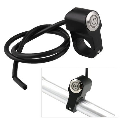 Black handlebar mount power switch with circular silver button and attached wire harness