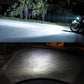 BA20D LED headlight projecting a white beam on the road at night