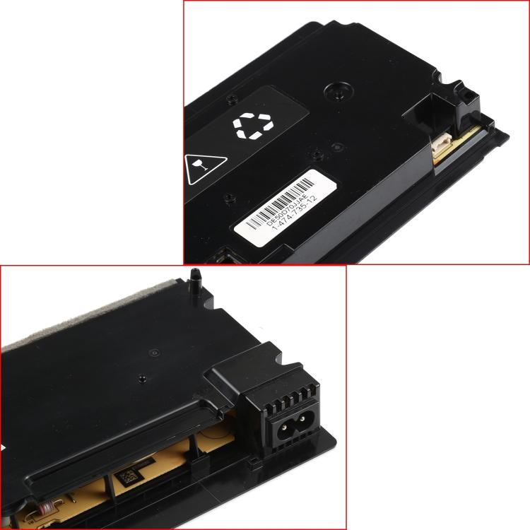 Game console power supply close-up showing main socket and internal board