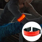 Rechargeable LED safety wrist belt with red glowing strip and reflective edges