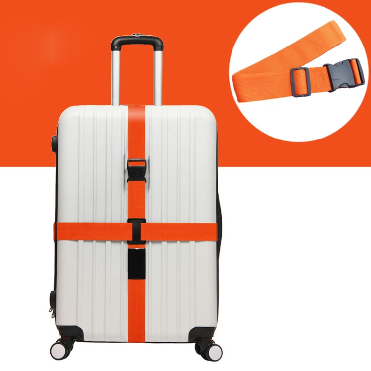 Orange elastic luggage packing straps with adjustable buckles on suitcase