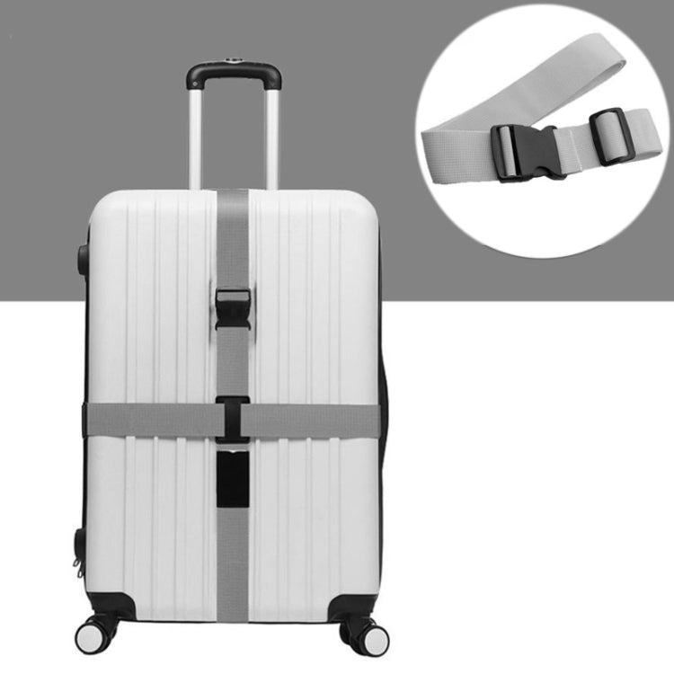 Gray luggage packing strap with adjustable buckle on suitcase