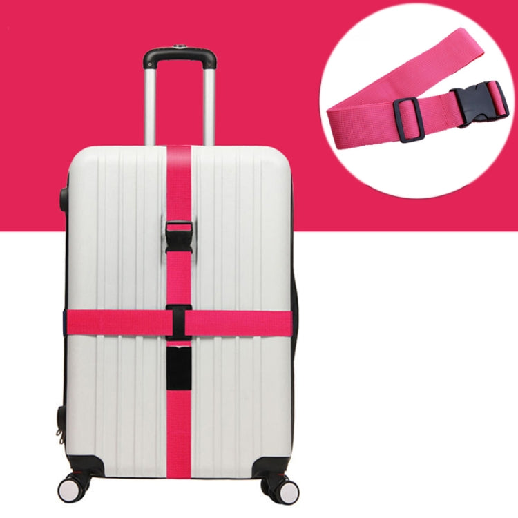 Elastic luggage packing belt with pink cross straps on striped suitcase