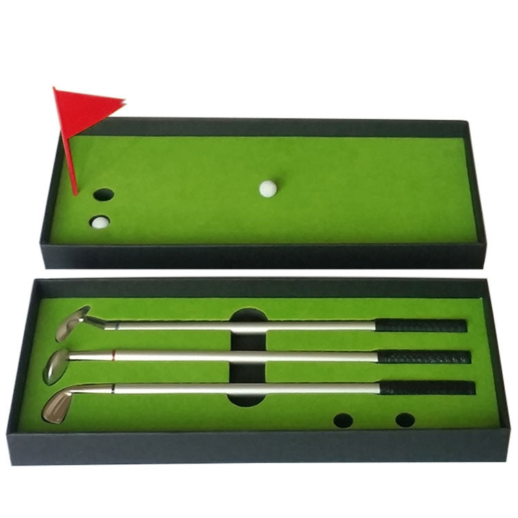 Golf mini putting mat trainer set in open box, green felt and three push rods