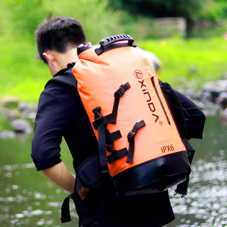 Waterproof 20L shoulder bag in orange with black trim, front buckles and straps