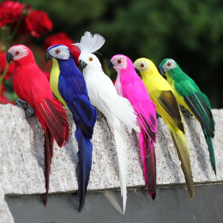Assorted colorful simulation parrot decorations lined up on a ledge, mixed red blue white