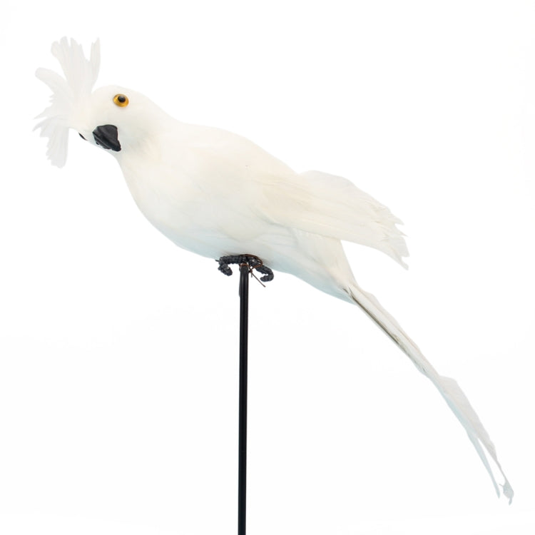 White simulated parrot decoration on a black stake, angled view
