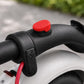 Red silicone cover for rear fender hook on an electric scooter handlebar