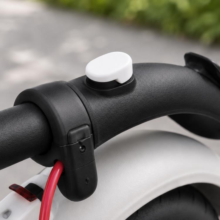 White silicone cover for rear fender hook on an electric scooter handlebar