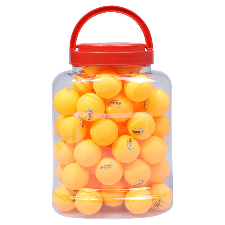 Table tennis training balls in clear jar, yellow balls with red handle and lid