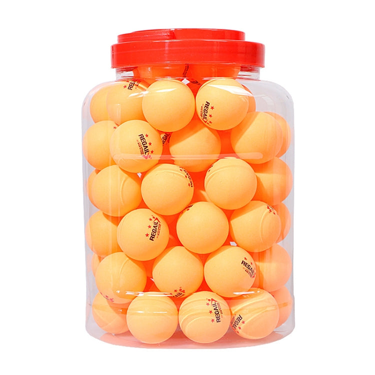 Clear jar of orange-yellow table tennis training balls with red cap