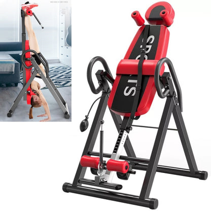 Red and black inverted crane exercise machine with padded seat and hand handles