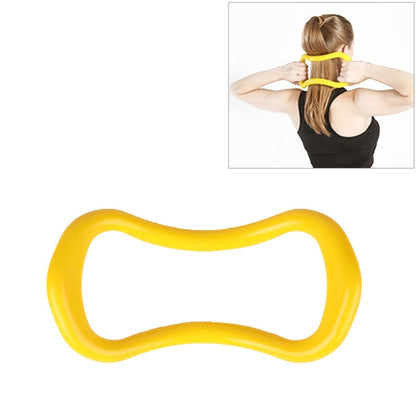 Yellow yoga and Pilates training ring for stretching and fascia release.