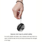 Hand holding a black YUNMAI wrist gyroball spinner connected by wrist cord
