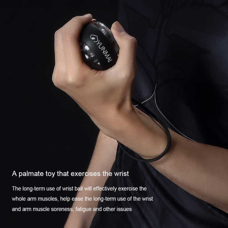 Black YUNMAI wrist gyroball spinner in hand on wrist strap for wrist exercise
