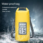 Yellow waterproof dry sack bag with roll-top closure and dual shoulder straps