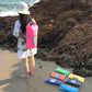 Pink waterproof dry sack bag with roll-top closure and dual shoulder straps