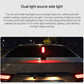 Emergency survival hammer projecting a red warning light above a car roof line