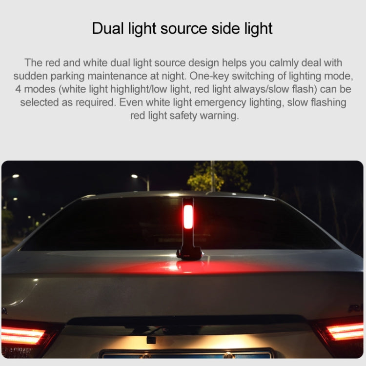 Emergency survival hammer projecting a red warning light above a car roof line