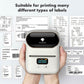 White Phomemo handheld thermal label printer held toward different label samples