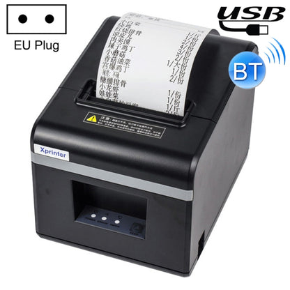 Black thermal receipt printer with paper window and Bluetooth indicator, EU plug shown.