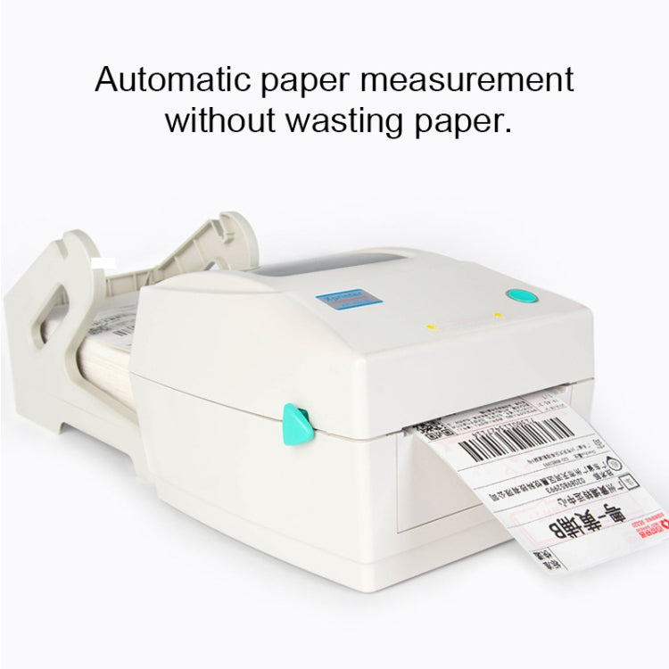 White thermal barcode printer with label exiting and top closed, compact side view.