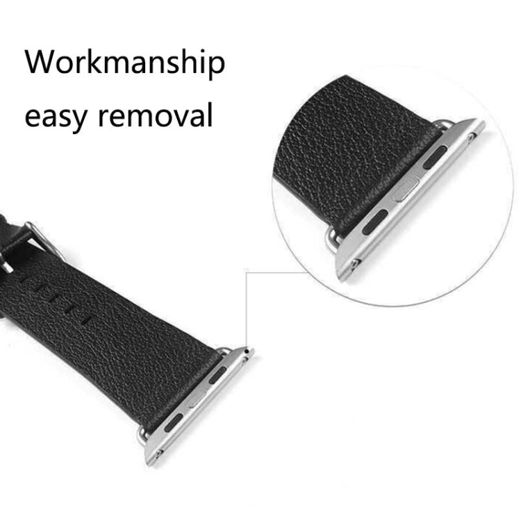Black leather watch strap with metal connector buckle pieces and pin holes