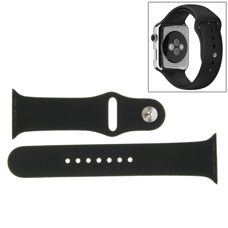Black rubber sport watch band with pin-and-tuck closure, band parts laid out