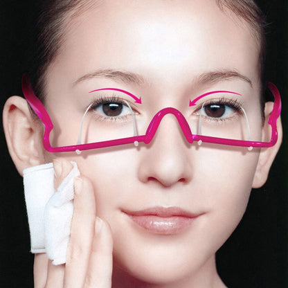 Double eyelid trainer glasses with pink frame, worn over eyes