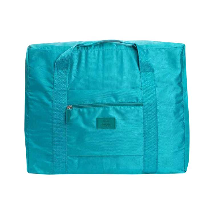 Teal foldable waterproof storage pouch with front zip pocket and adjustable carry strap