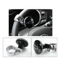 Steering wheel spinner knob attached to a dark steering wheel with chrome mount