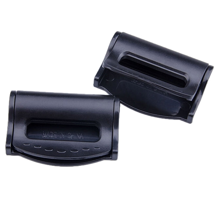 Black car seat belt adjuster clips, two-piece set shown on white background