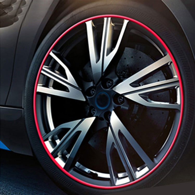 Red wheel rim trim ring around alloy wheel spokes