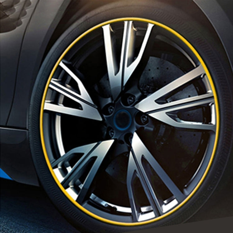 Yellow wheel rim trim ring around alloy wheel