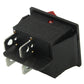 Black rocker switch with mounting lugs and prongs, showing red indicator window