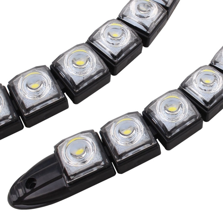 Close-up of square SMD LED modules on a black flexible LED snake strip