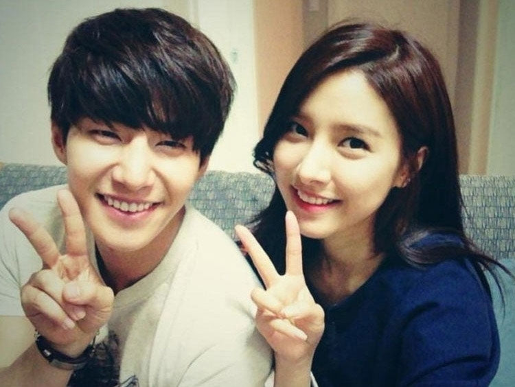 Two people smiling while posing together