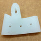 White hallux valgus toe brace pad with oval cutouts, laid flat