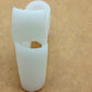White hallux valgus toe brace shown in side profile, laid flat