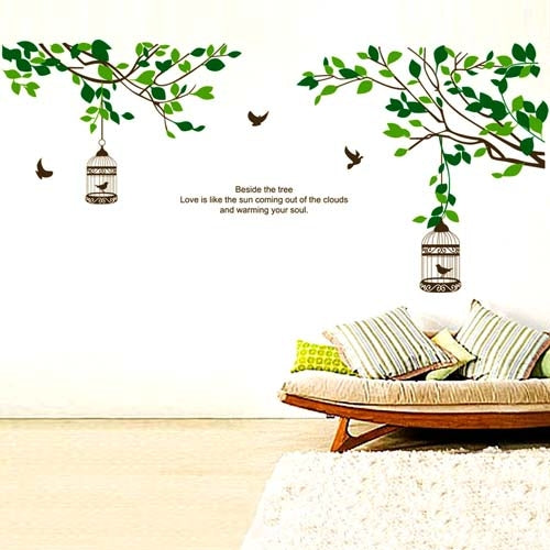 Removable wall sticker set with green tree branches, birds, and hanging birdcage