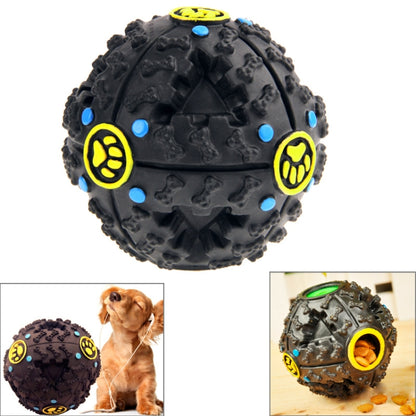 Black rubber squeaky chew ball toy with blue dots and yellow paw-shaped accents